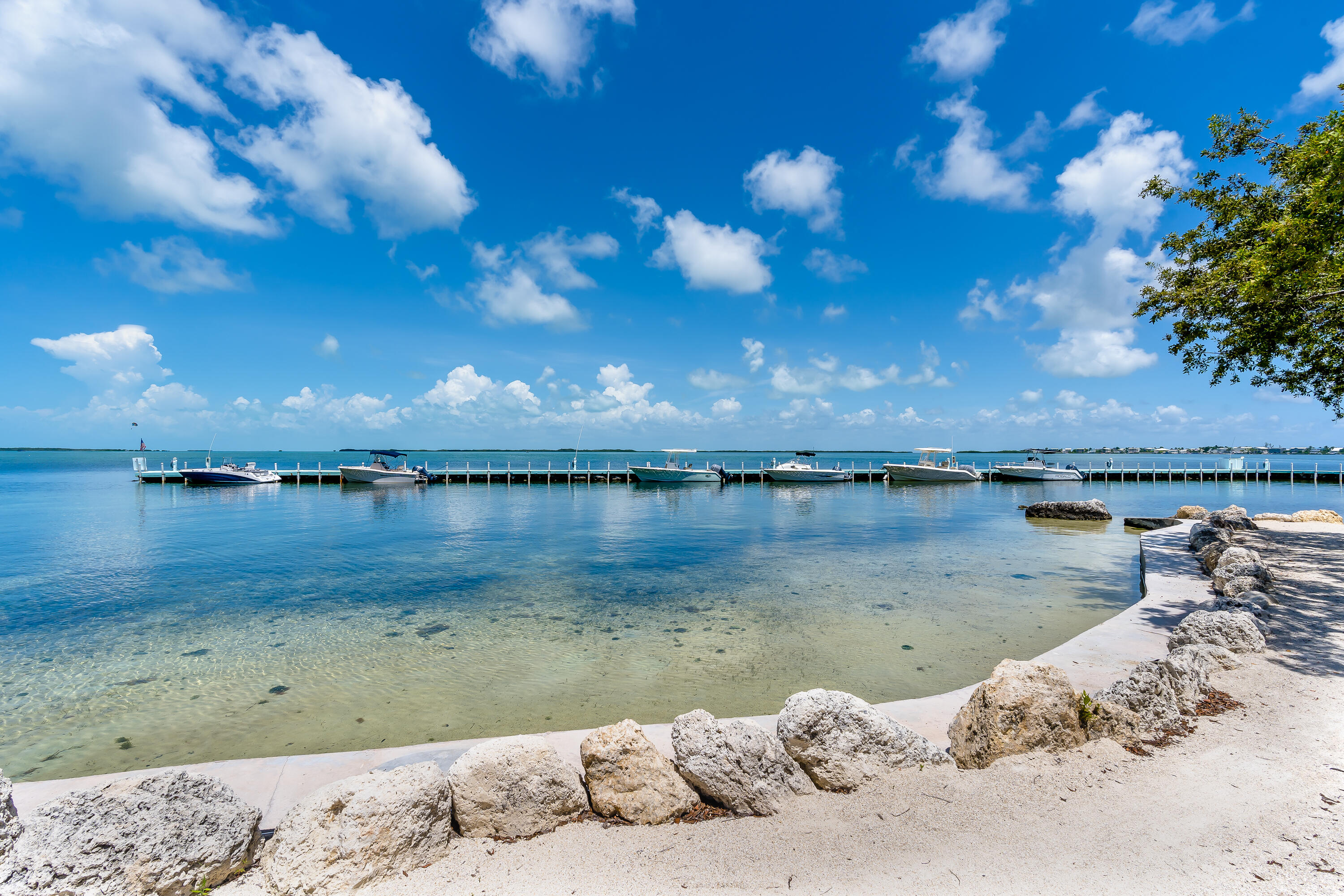 97652 Overseas Highway, Unit P6 Key Largo, FL 33037 - Photo 45 of 79 a view of a lake from a balcony