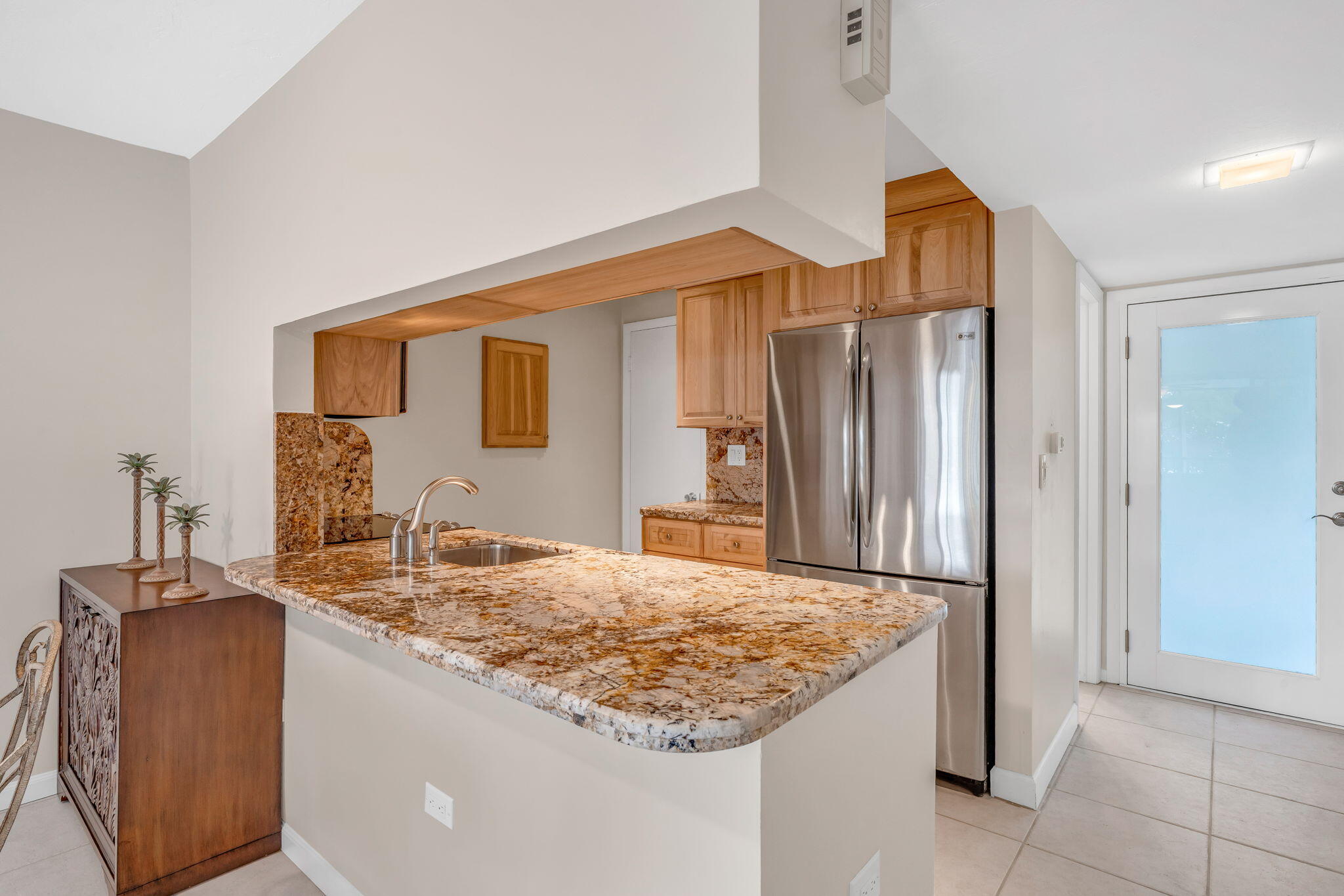 97652 Overseas Highway, Unit P6 Key Largo, FL 33037 - Photo 7 of 79 a bathroom with a granite countertop sink and a mirror