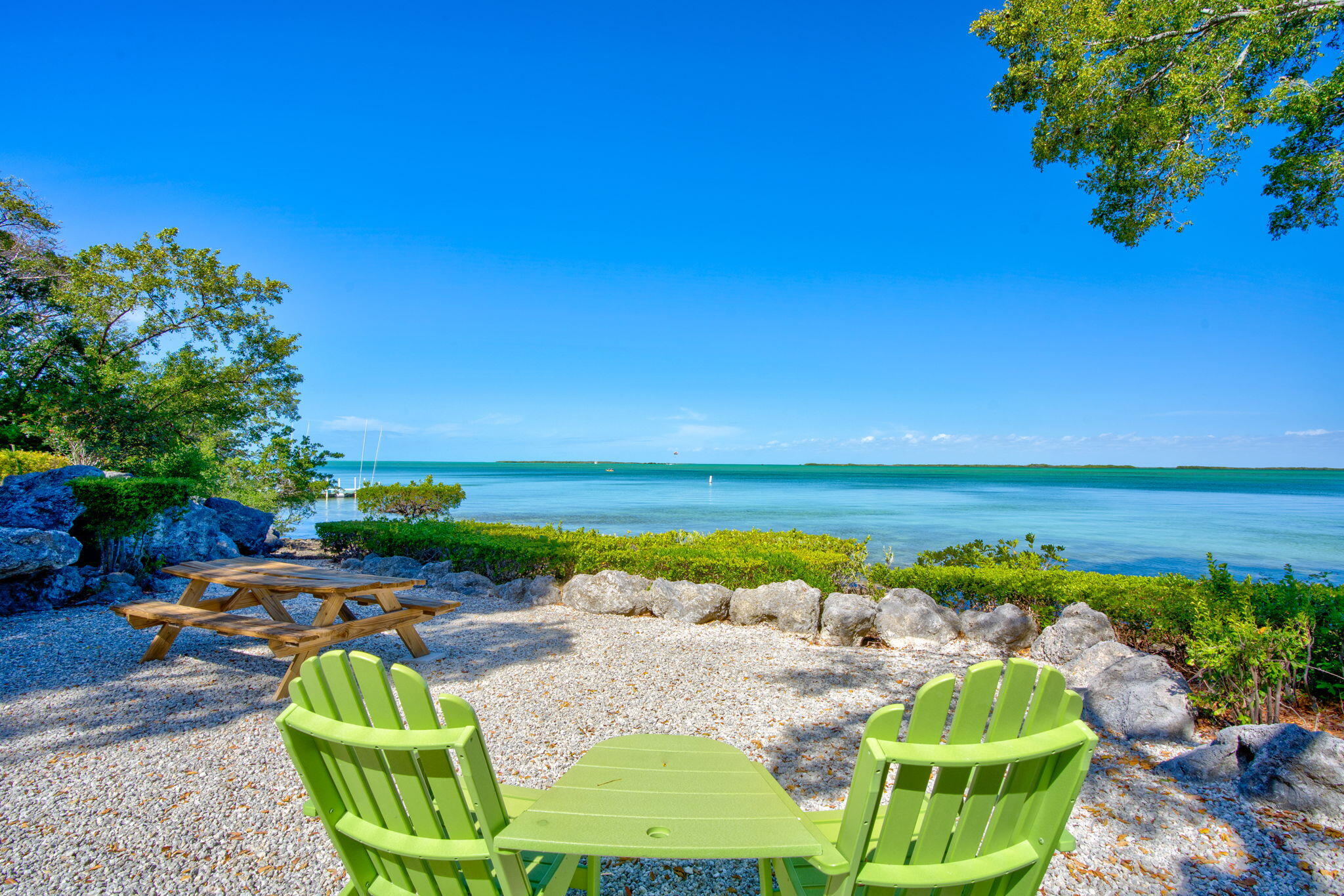 97652 Overseas Highway, Unit P6 Key Largo, FL 33037 - Photo 70 of 79 a view of swimming pool with outdoor seating and plants