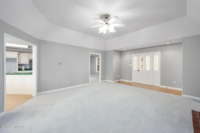 a view of empty room with windows