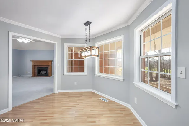 a view of a kitchen with a large window