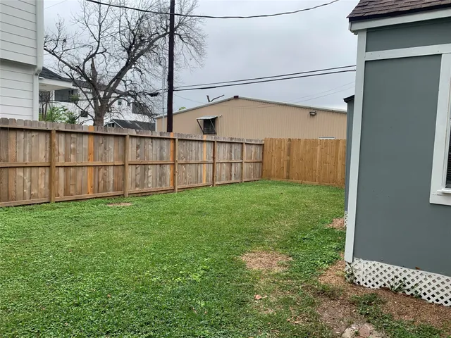 a view of backyard with small cabin