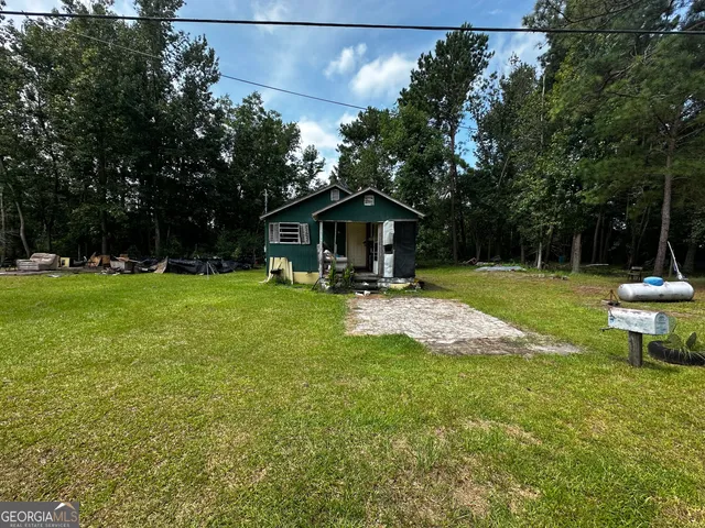 a view of a garden with a bench