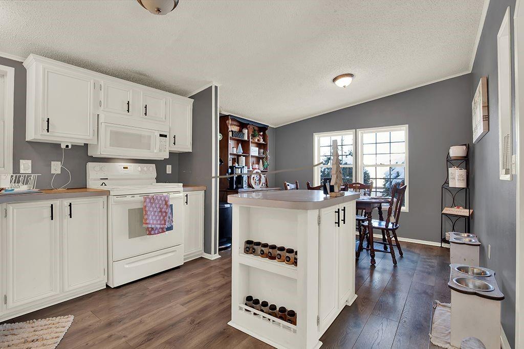 123 Laura Lane Elizabeth, PA 15037 - Photo 16 of 27 a kitchen with a stove top oven and white cabinets