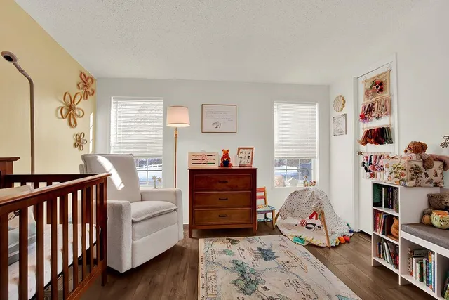 a bedroom with furniture and a wooden floor