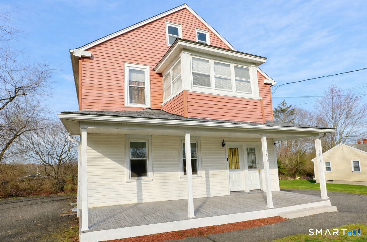493 High Street Milford, CT 06461 - Photo 3 of 6 a front view of a house with a yard