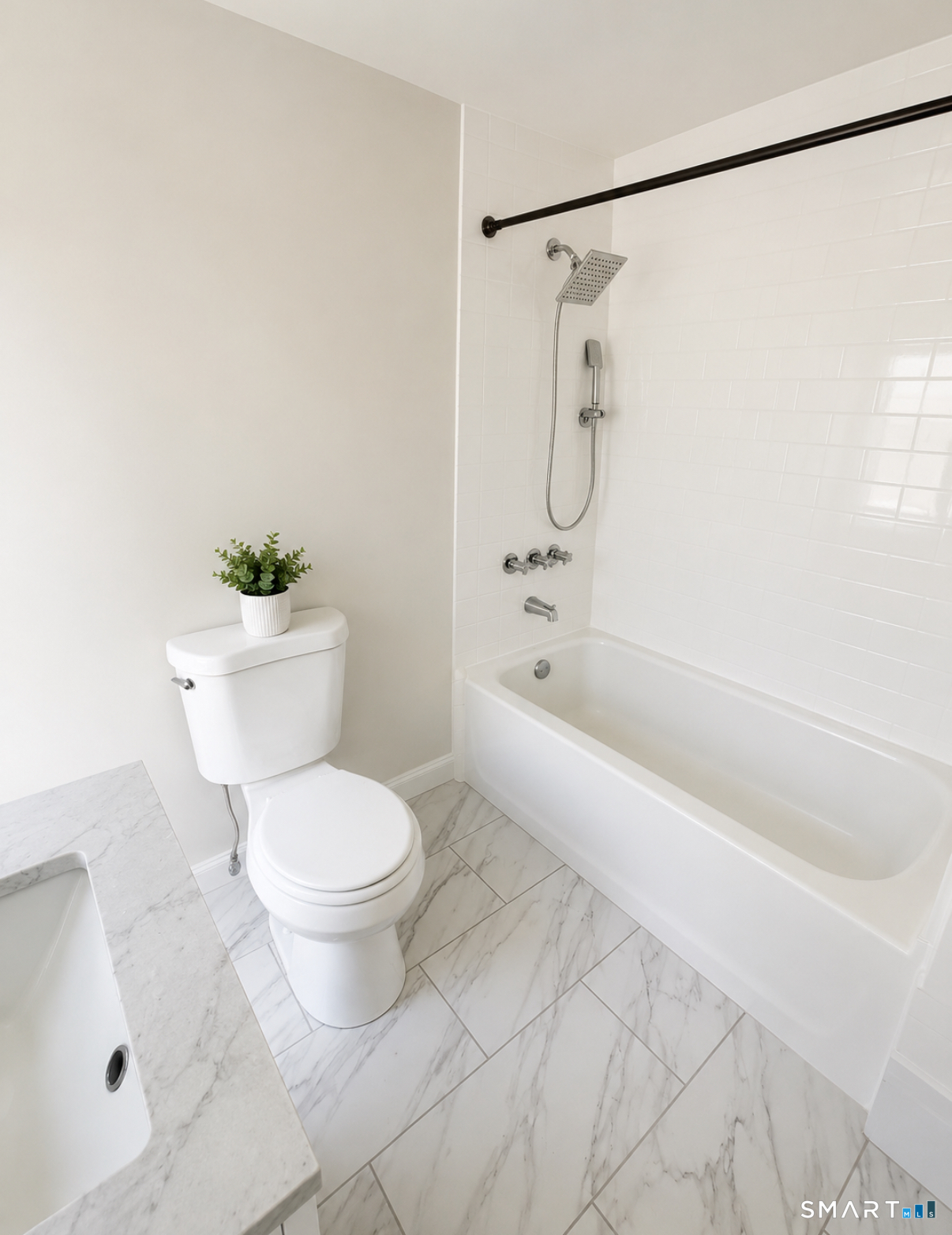 493 High Street Milford, CT 06461 - Photo 4 of 10 a bathroom with a toilet and a shower