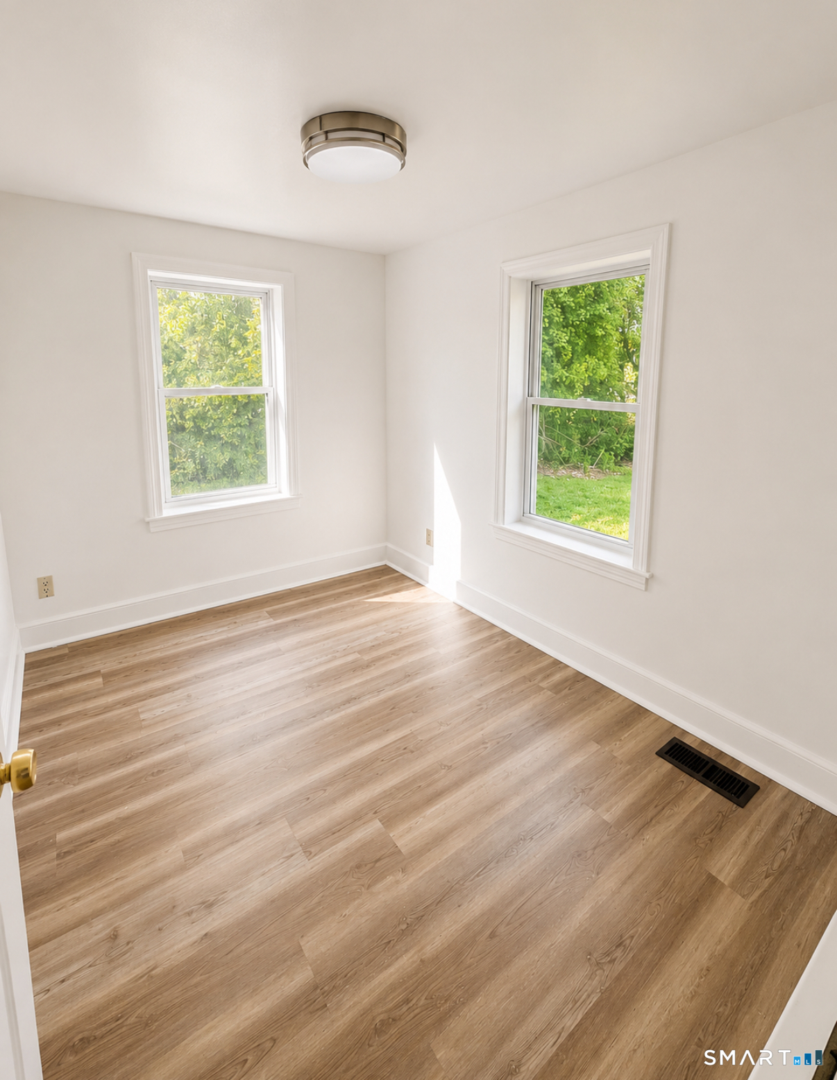 493 High Street Milford, CT 06461 - Photo 10 of 10 an empty room with wooden floor and windows