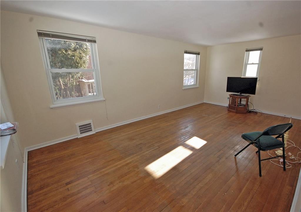 1955 Spring Valley Road Pittsburgh, PA 15243 - Photo 2 of 14 Living room with hardwood floors and newer windows.