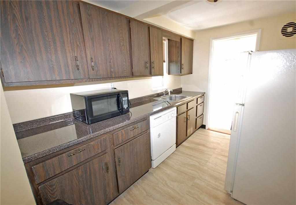 1955 Spring Valley Road Pittsburgh, PA 15243 - Photo 5 of 14 Efficient kitchen includes dishwasher, gas stove and fridge.