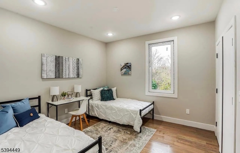 376 21st Street Irvington, NJ 07111 - Photo 11 of 24 a bedroom with a bed and a window