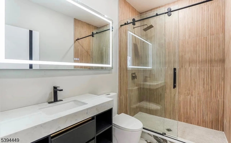 376 21st Street Irvington, NJ 07111 - Photo 12 of 24 a bathroom with a sink a toilet a shower and a window