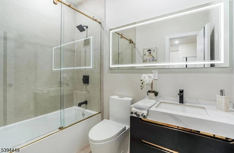 376 21st Street Irvington, NJ 07111 - Photo 14 of 24 a bathroom with a sink a toilet and shower