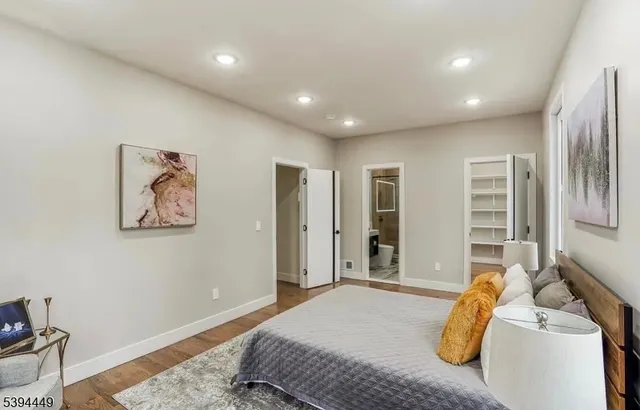 a bedroom with furniture and a window