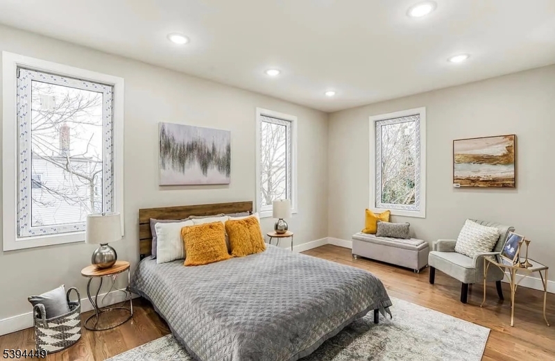 376 21st Street Irvington, NJ 07111 - Photo 19 of 24 a bedroom with a bed and wooden floor