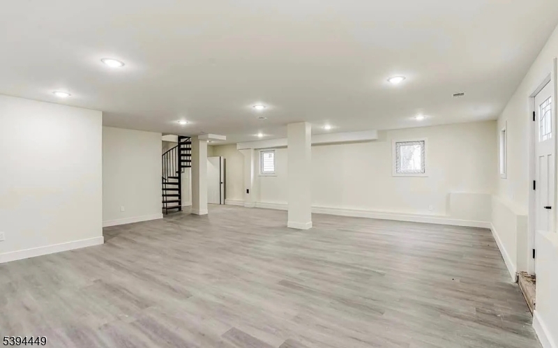 376 21st Street Irvington, NJ 07111 - Photo 22 of 24 a view of an empty room with wooden floor