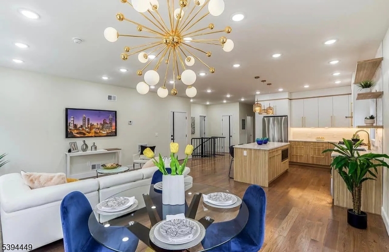 376 21st Street Irvington, NJ 07111 - Photo 4 of 24 a dining room with furniture and a potted plant