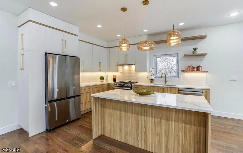 376 21st Street Irvington, NJ 07111 - Photo 10 of 24 a kitchen with stainless steel appliances granite countertop a refrigerator a sink dishwasher and a stove with wooden floor