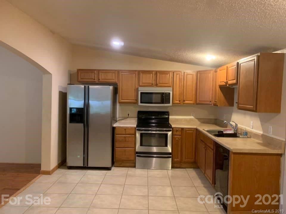290 John Smith Road Rutherfordton, NC 28139 - Photo 2 of 16 a kitchen with stainless steel appliances granite countertop a refrigerator and a stove