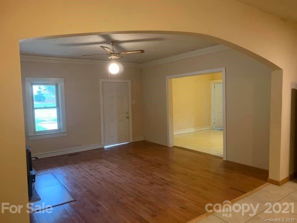 290 John Smith Road Rutherfordton, NC 28139 - Photo 13 of 16 a view of an empty room with wooden floor and a window