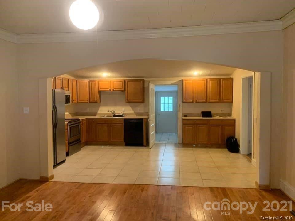 290 John Smith Road Rutherfordton, NC 28139 - Photo 4 of 16 a large kitchen with a large counter top a sink stainless steel appliances and cabinets