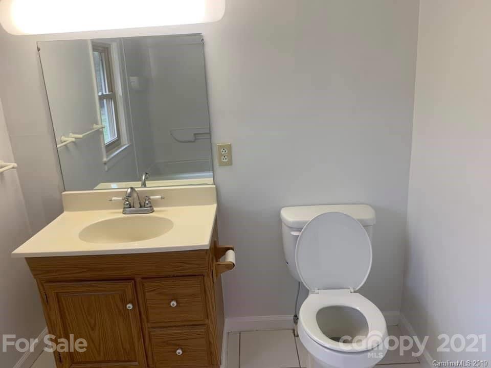 290 John Smith Road Rutherfordton, NC 28139 - Photo 8 of 16 a bathroom with a toilet sink and mirror