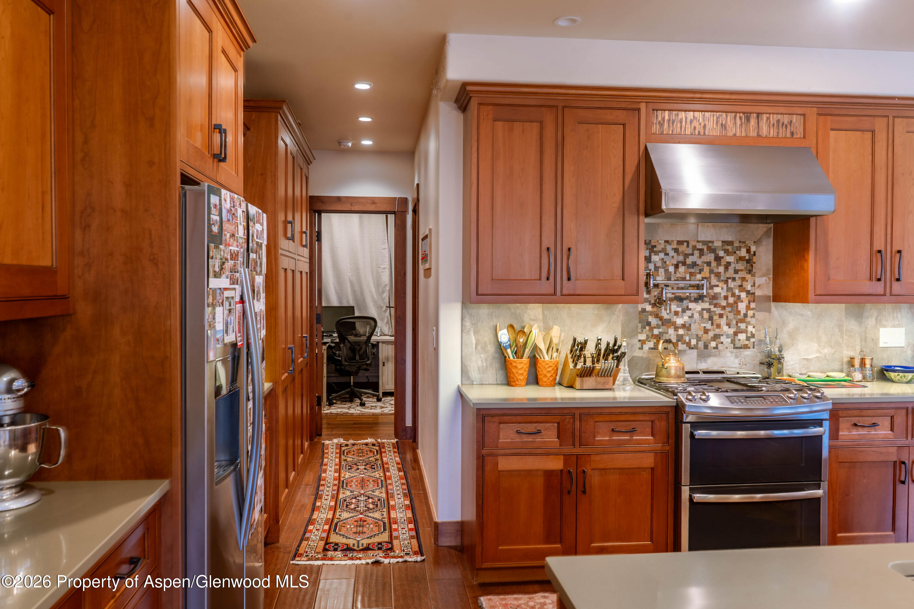 109 Valley Court Basalt, CO 81621 - Photo 16 of 41 a kitchen with stainless steel appliances granite countertop a stove and a refrigerator