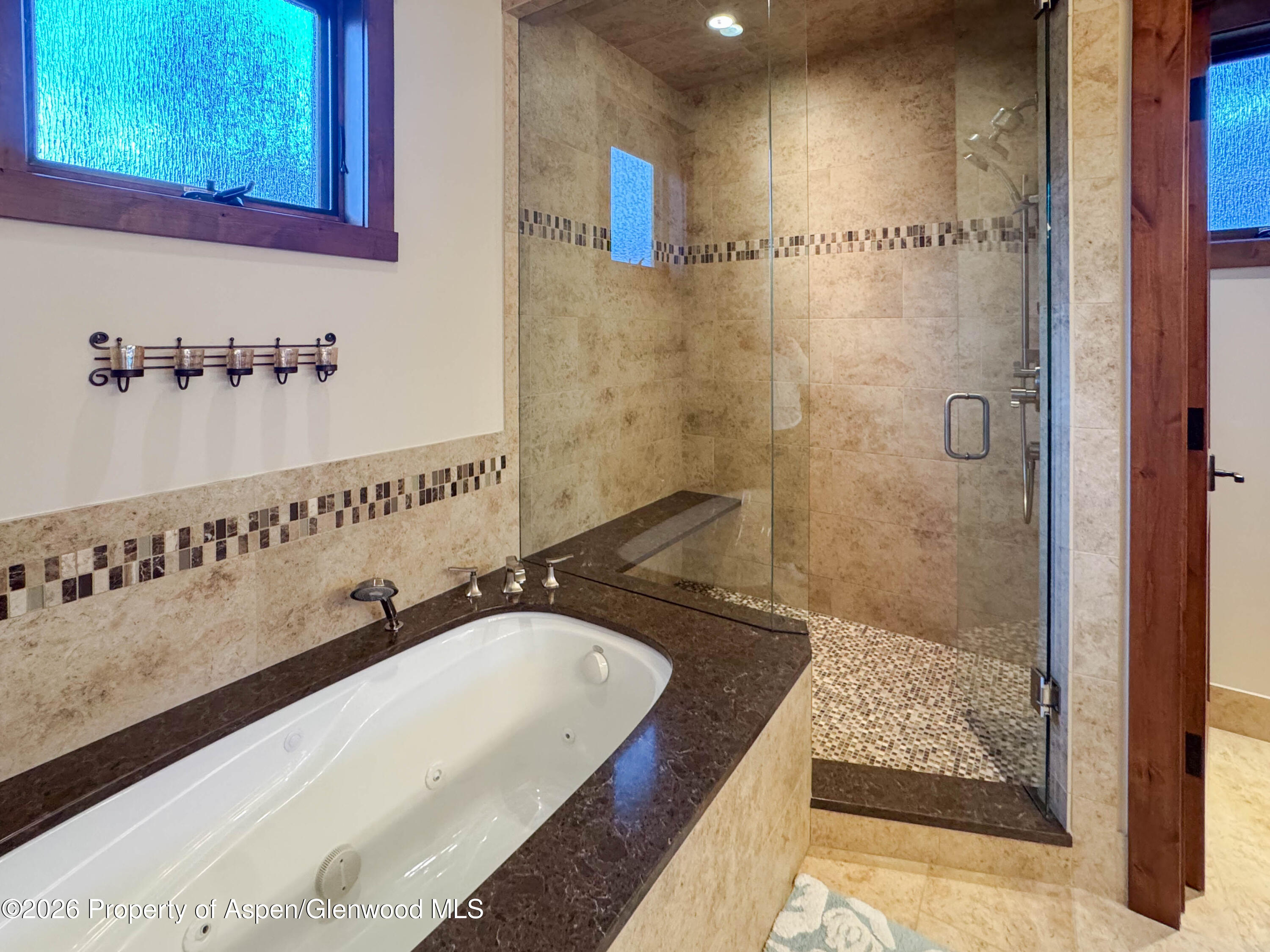 109 Valley Court Basalt, CO 81621 - Photo 21 of 41 a bathroom with a granite countertop sink a mirror and shower