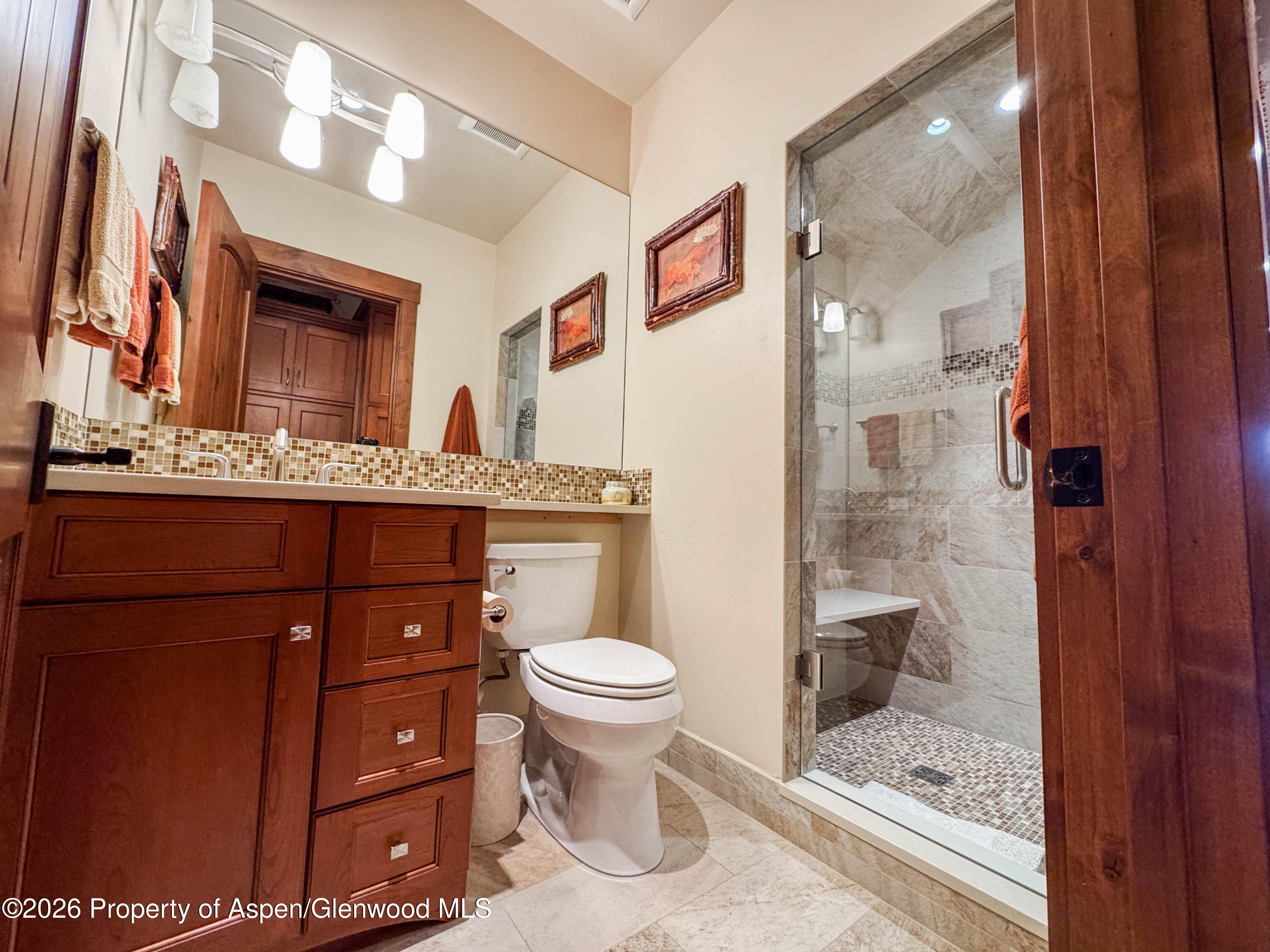 109 Valley Court Basalt, CO 81621 - Photo 38 of 41 a bathroom with a granite countertop toilet sink and mirror