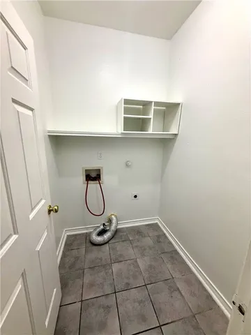 a room with exposed pipes and a window