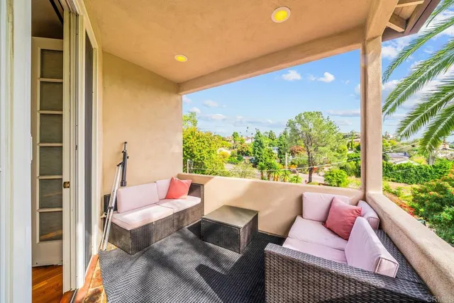 a outdoor living space with furniture and a potted plant
