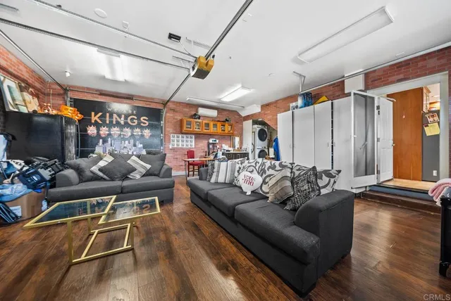 a outdoor living space with patio furniture and a flat screen tv