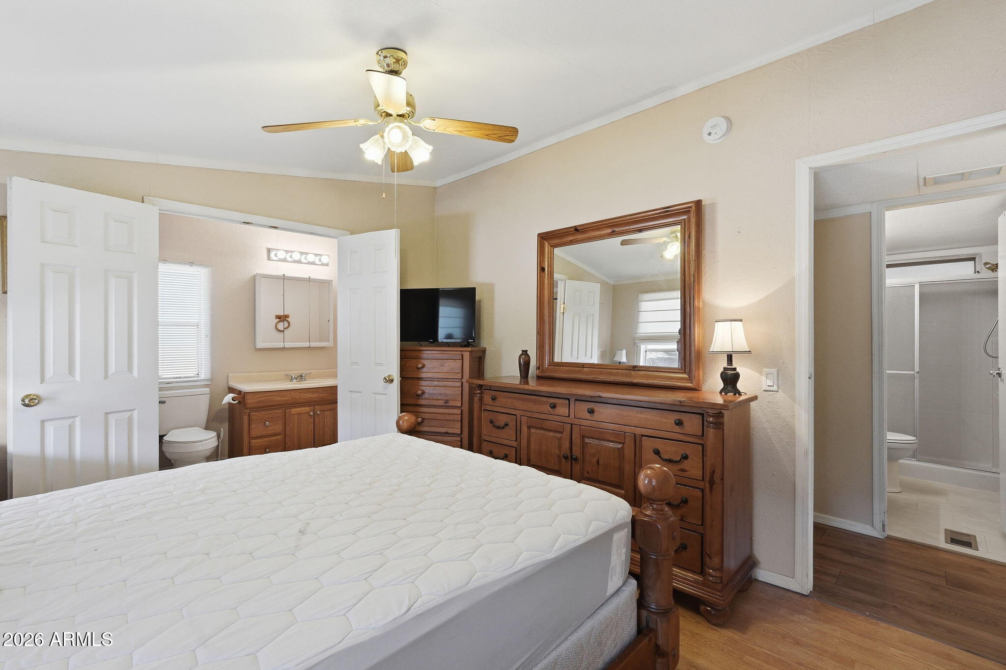 53 North Mountain Road, Unit 38 Apache Junction, AZ 85120 - Photo 18 of 35 a bedroom with a bed and a dresser