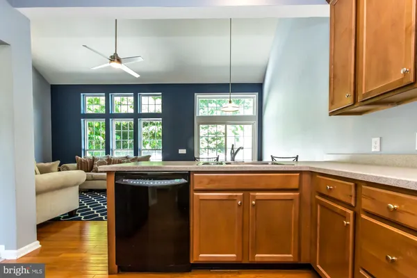 a kitchen with wooden cabinets and a sink