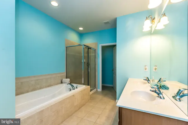 a bathroom with a bathtub and a sink