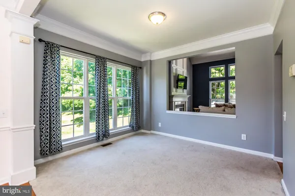 a view of an empty room with a large window