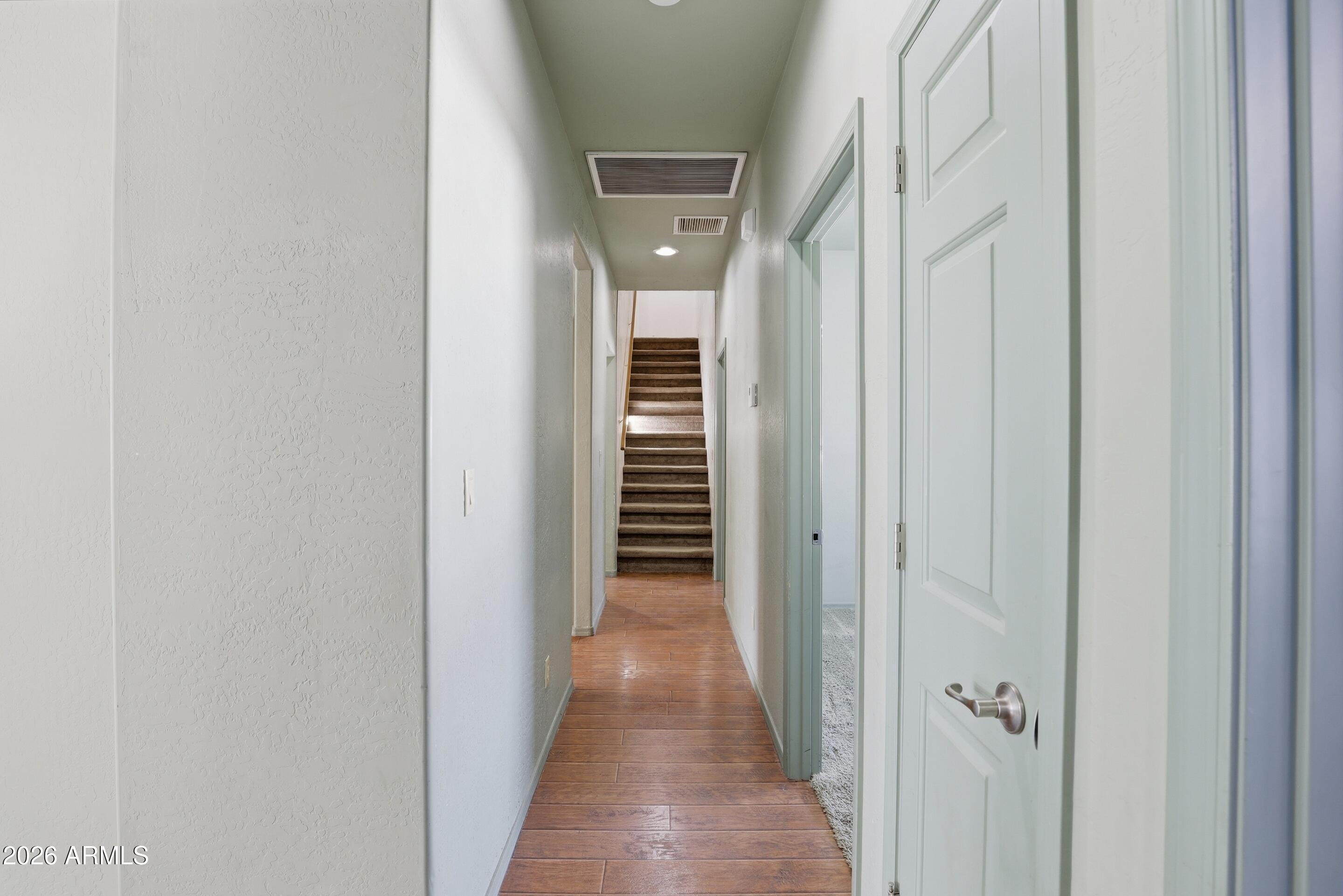 228 Windmill Road Payson, AZ 85541 - Photo 29 of 42 a view of a hallway with wooden floor and stairs