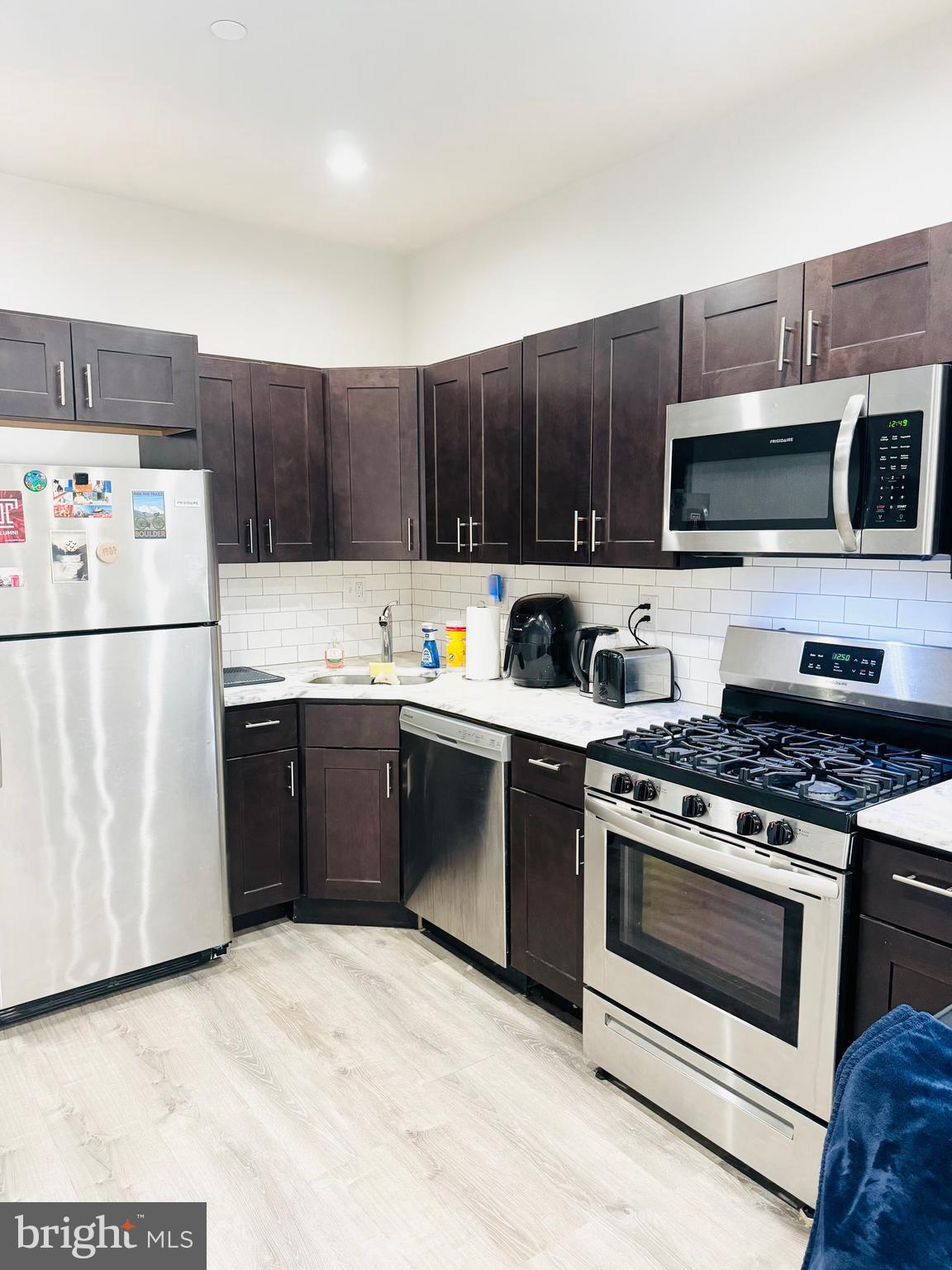 2327 Wharton Street, Unit 2 Philadelphia, PA 19146 - Photo 12 of 19 a kitchen with a refrigerator stove and microwave