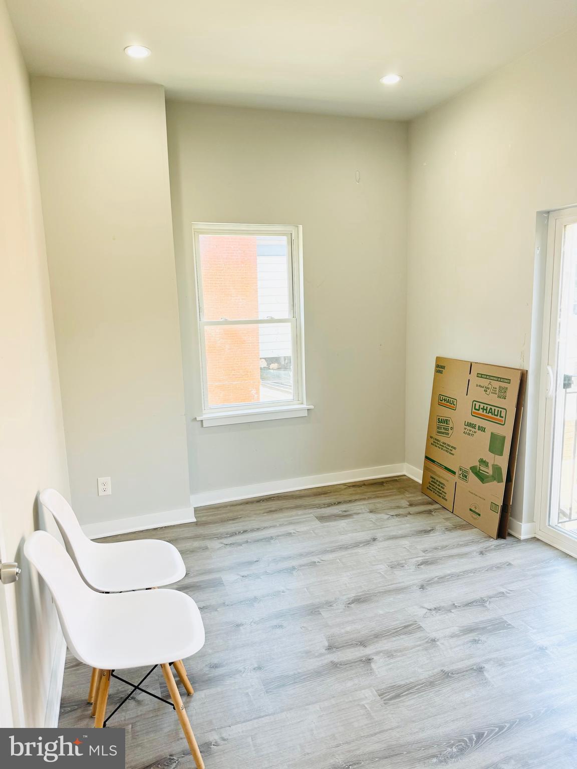2327 Wharton Street, Unit 2 Philadelphia, PA 19146 - Photo 17 of 19 a view of a room with wooden floor and a window