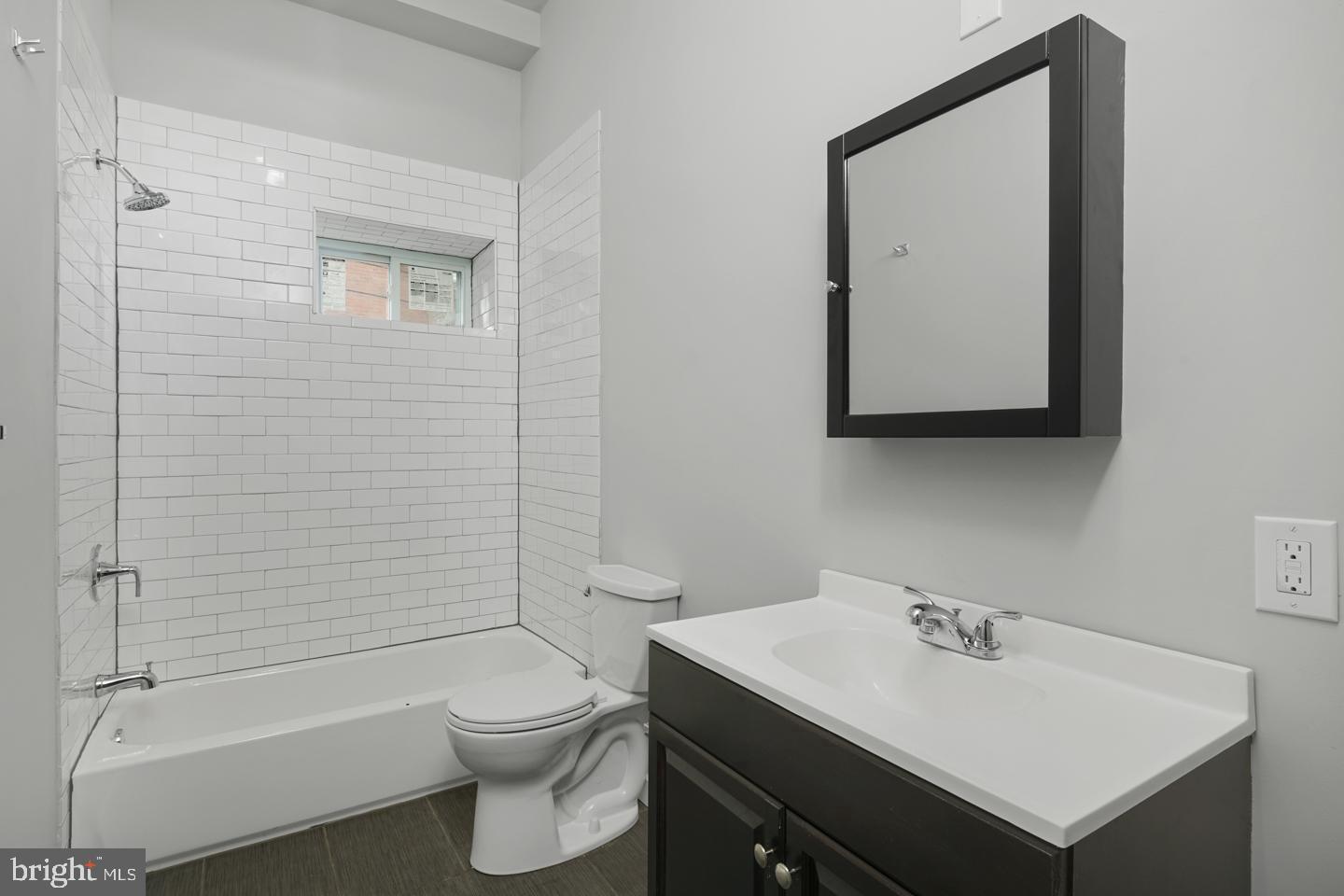 2327 Wharton Street, Unit 2 Philadelphia, PA 19146 - Photo 4 of 19 a bathroom with a sink toilet and shower