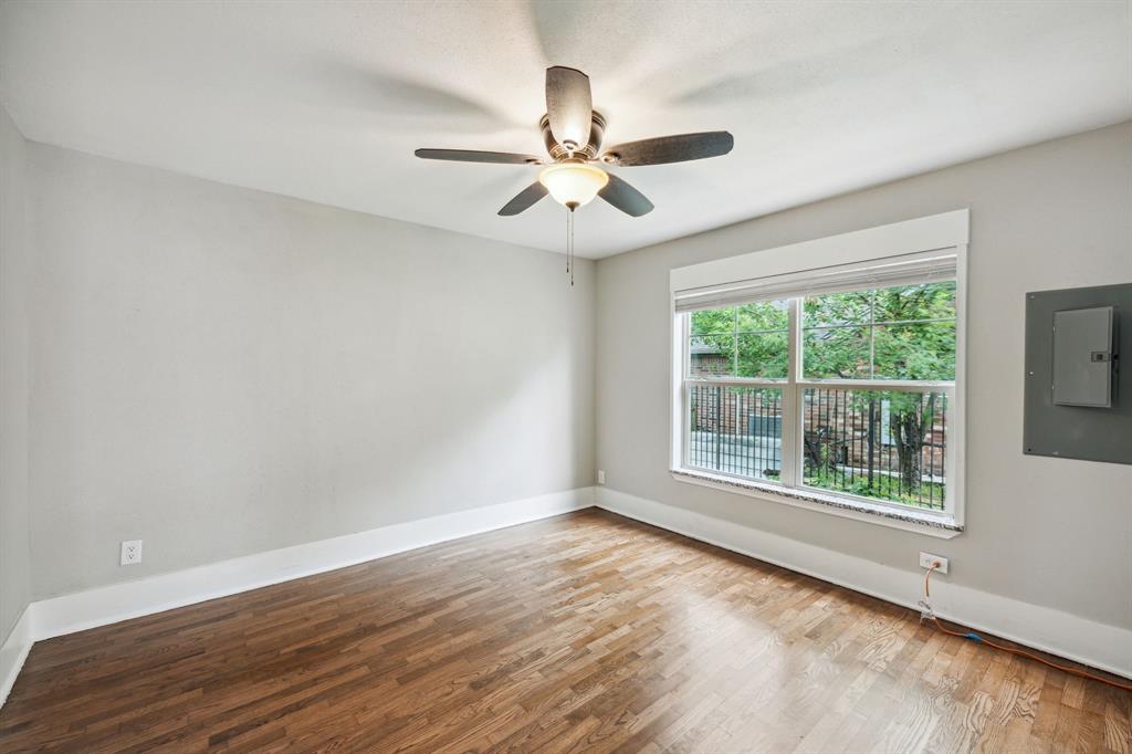 1605 South Walnut Street Sherman, TX 75090 - Photo 11 of 28 a view of an empty room with wooden floor and a window