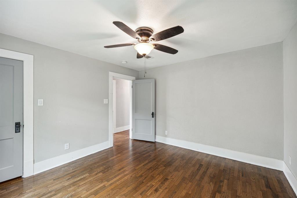 1605 South Walnut Street Sherman, TX 75090 - Photo 12 of 28 a view of an empty room with wooden floor