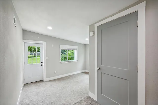 a view of an empty room with a window