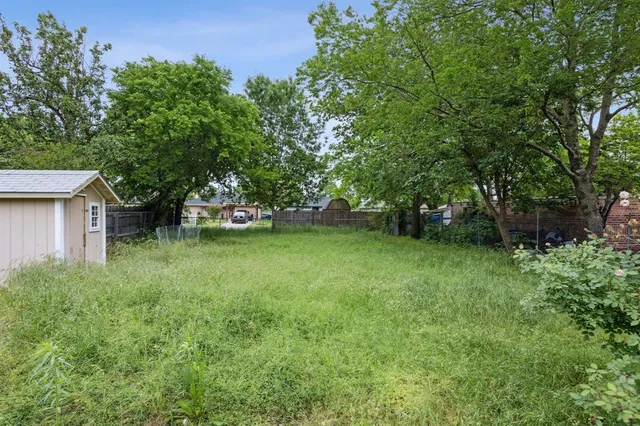 a backyard of a house with lots of green space