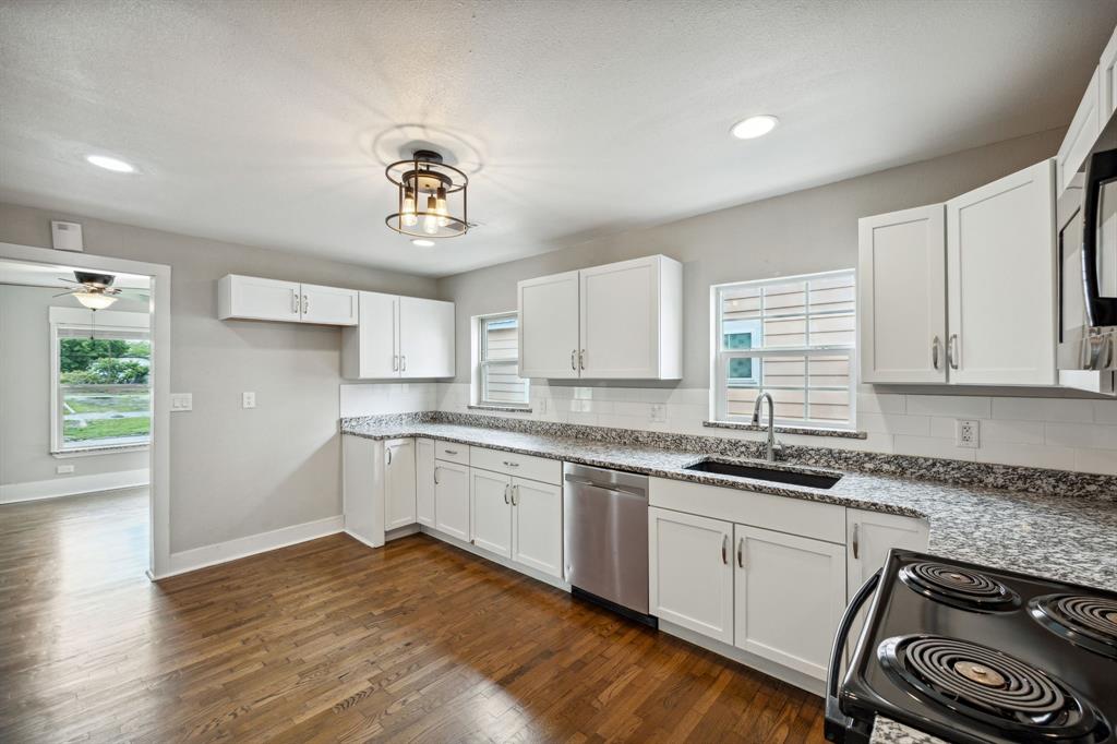 1605 South Walnut Street Sherman, TX 75090 - Photo 8 of 28 a kitchen with a sink stove and cabinets