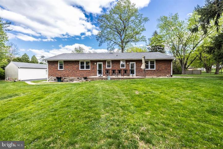 902 Croton Road Wayne, PA 19087 - Photo 2 of 37 a front view of house with yard and green space