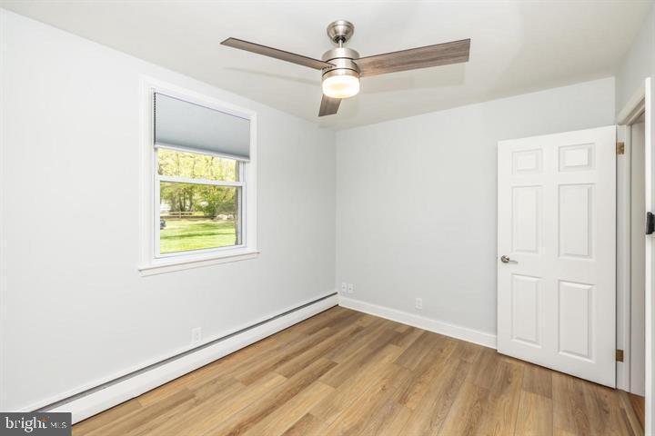 902 Croton Road Wayne, PA 19087 - Photo 21 of 37 an empty room with a window and wooden floor