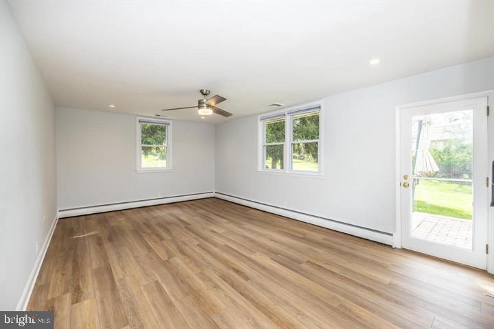902 Croton Road Wayne, PA 19087 - Photo 29 of 37 a view of an empty room with wooden floor and a window