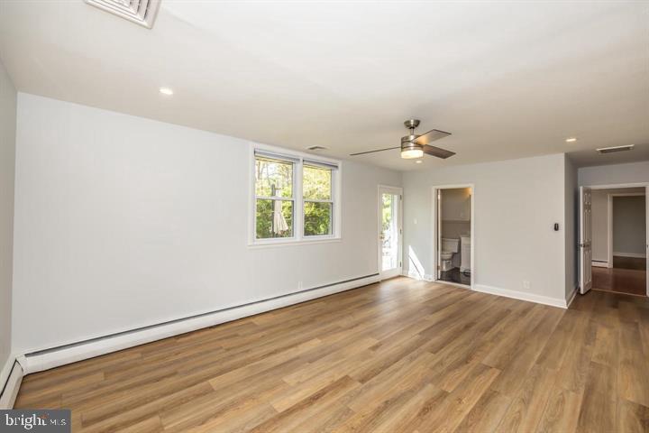 902 Croton Road Wayne, PA 19087 - Photo 30 of 37 an empty room with wooden floor and windows