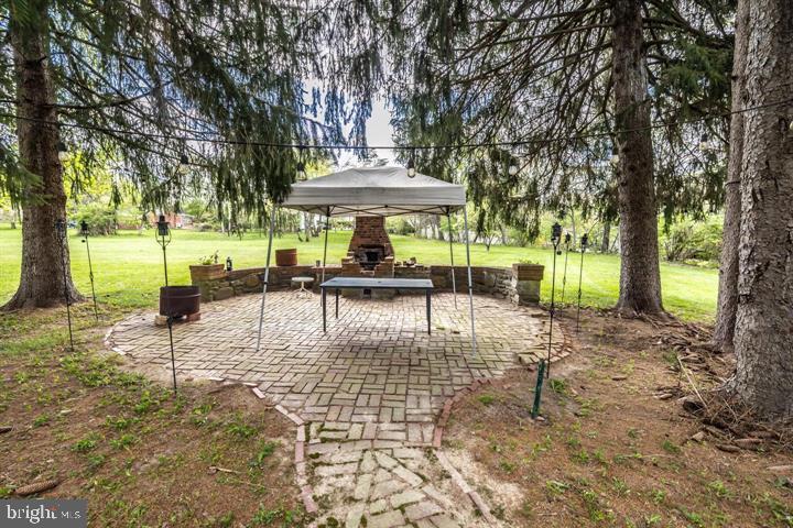 902 Croton Road Wayne, PA 19087 - Photo 3 of 37 a view of a swimming pool with a patio